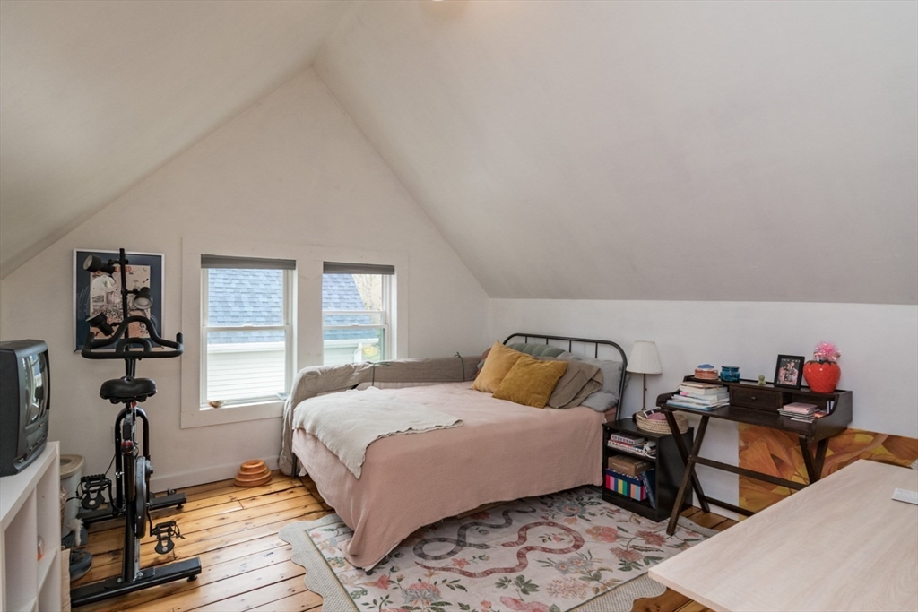 25 Morgan Street Holyoke, MA 01040 - Photo 24 of 41 a bedroom with a bed and wooden floor