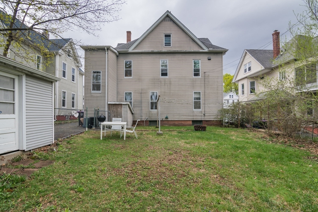 25 Morgan Street Holyoke, MA 01040 - Photo 36 of 41 a view of a house with a yard and sitting area