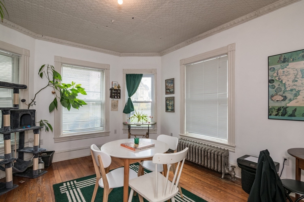 25 Morgan Street Holyoke, MA 01040 - Photo 7 of 41 a view of a dining room with furniture window and wooden floor