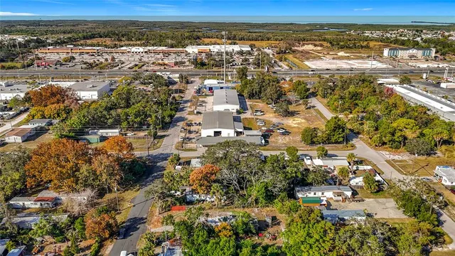 an aerial view of residential houses with city view