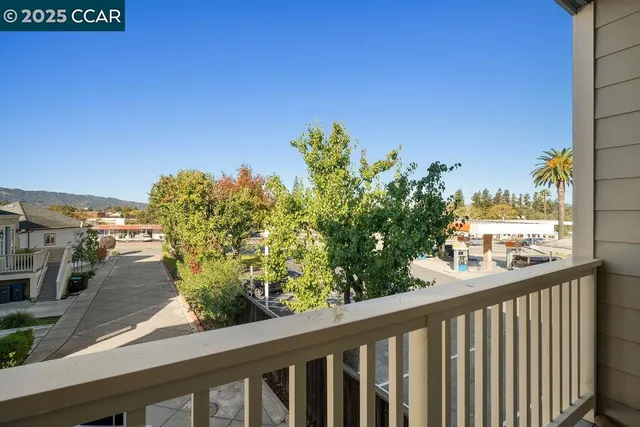 a view of a balcony with wooden floor
