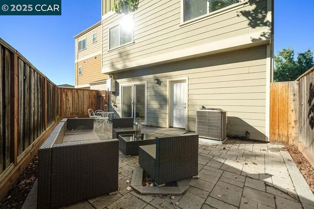 a view of a patio with table and chairs