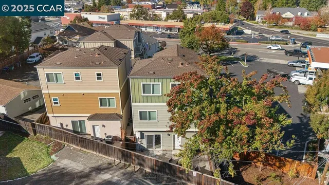 an aerial view of a house with a yard and balcony