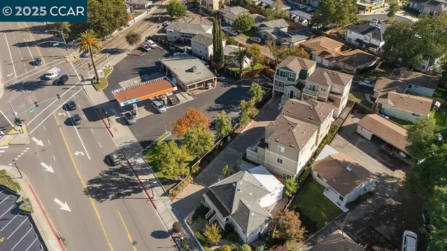 an aerial view of a house with outdoor space