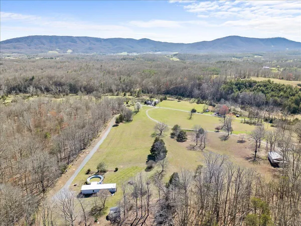 a view of a swimming pool and mountains