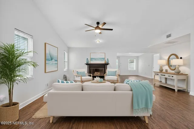 a kitchen with stainless steel appliances granite countertop a refrigerator a sink and a stove