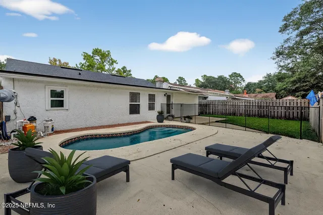 a front view of a house with a garden and porch