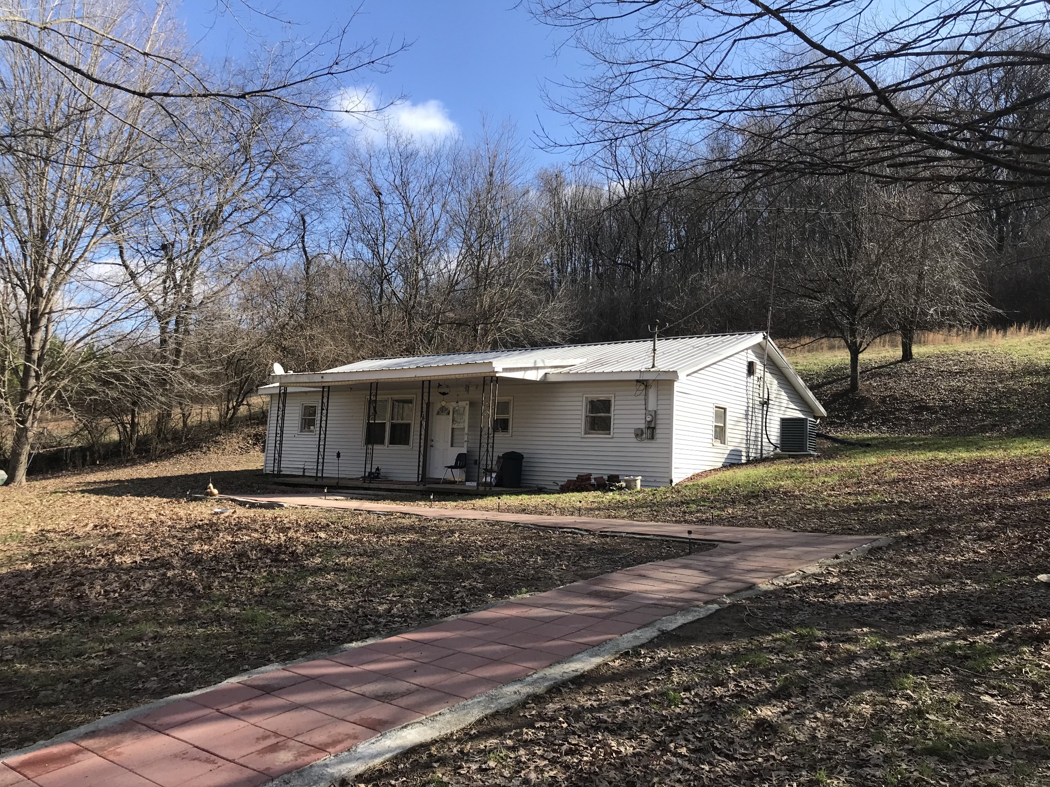165 Ben Johnson Road Pulaski, TN 38478 - Photo 2 of 33 a white house that has a tree in front of it