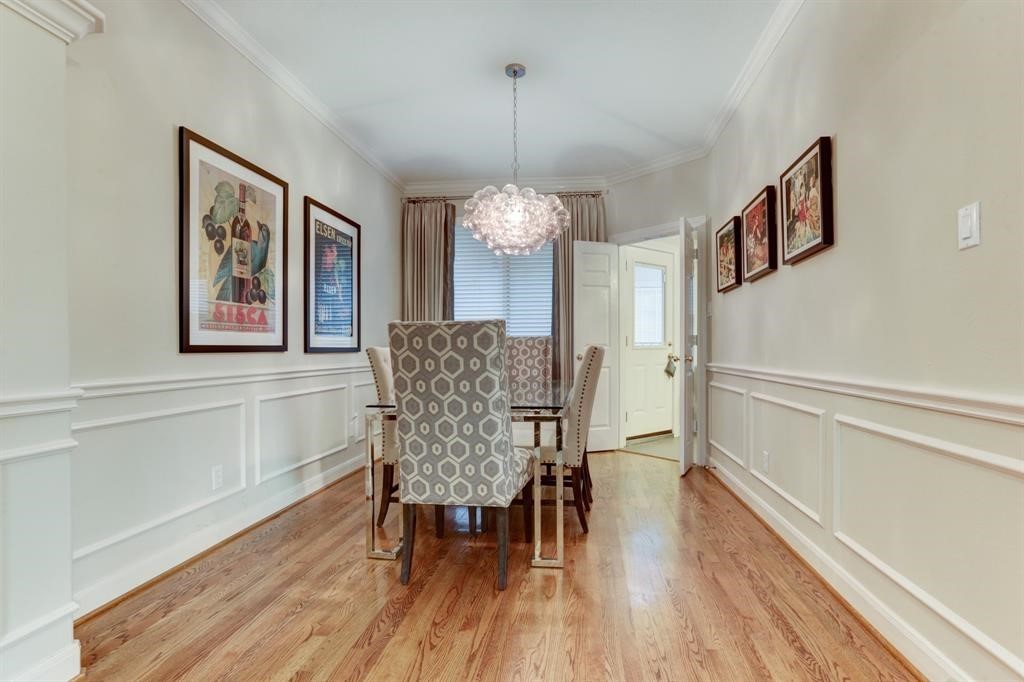 248 Westcott Street Houston, TX 77007 - Photo 17 of 32 a dining room with furniture and wooden floor
