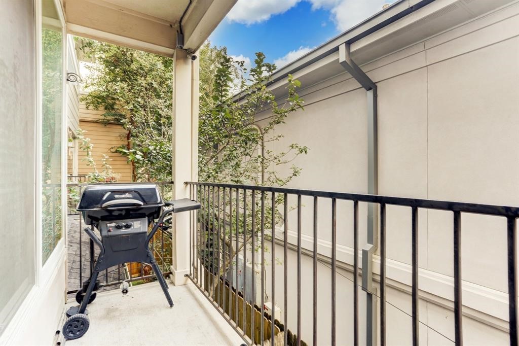 248 Westcott Street Houston, TX 77007 - Photo 23 of 32 a view of a balcony with chair and a potted plant