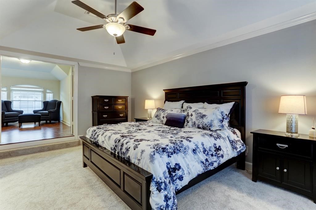 248 Westcott Street Houston, TX 77007 - Photo 29 of 32 a bedroom with bed and a chandelier