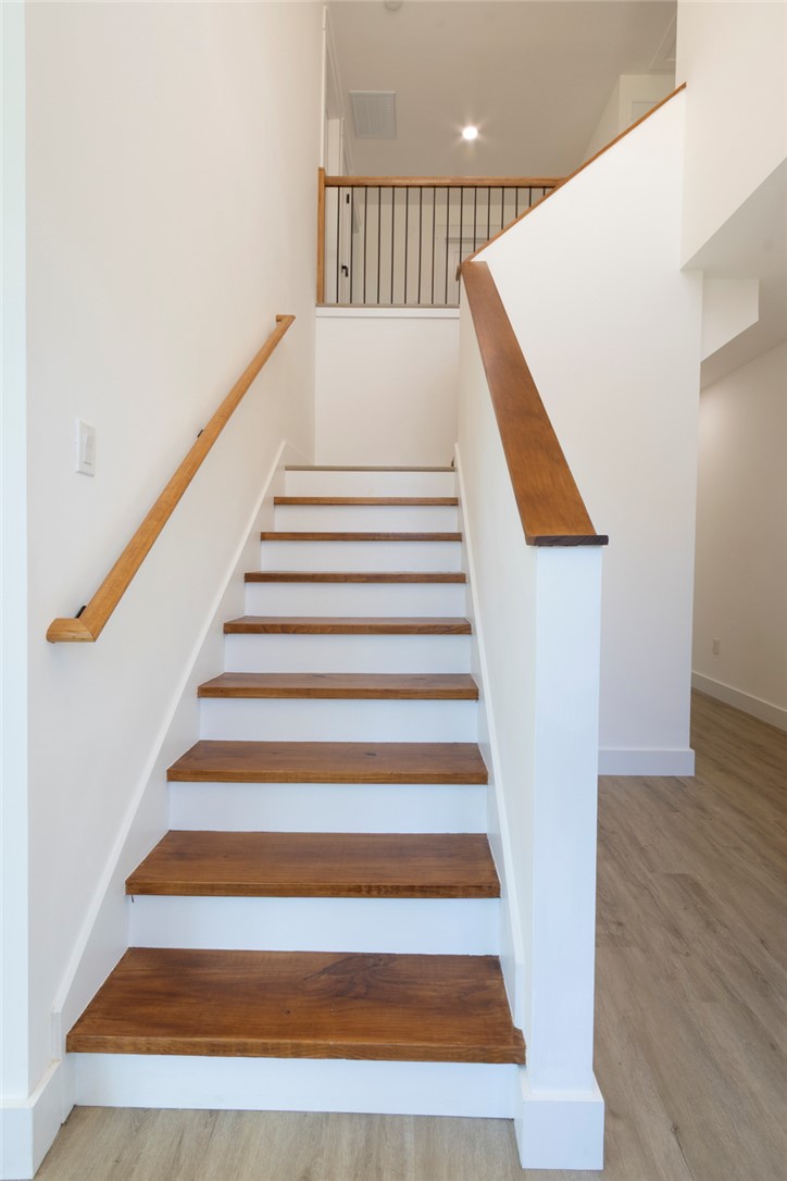 230 Hammond Circle Anderson, SC 29621 - Photo 24 of 48 These hardwood stairs with a sleek banister offer a warm and inviting transition between levels.