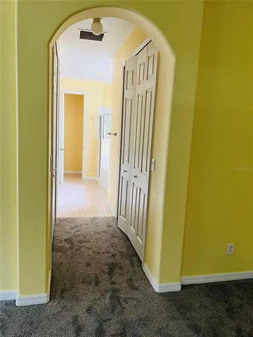 a view of a hallway with a door