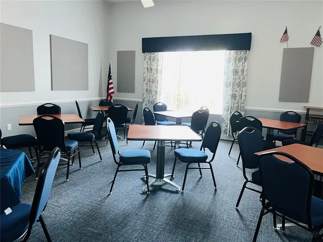 a dining room with furniture and window