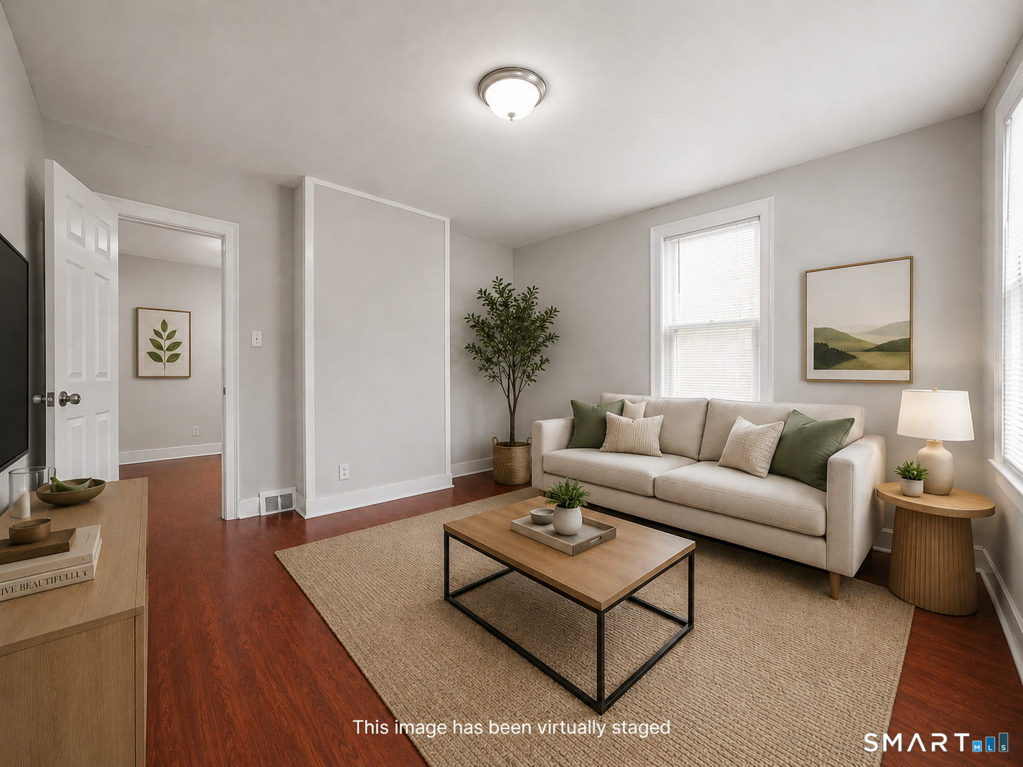 73 Orange Street Bridgeport, CT 06607 - Photo 3 of 33 a living room with furniture a wooden floor and a flat screen tv