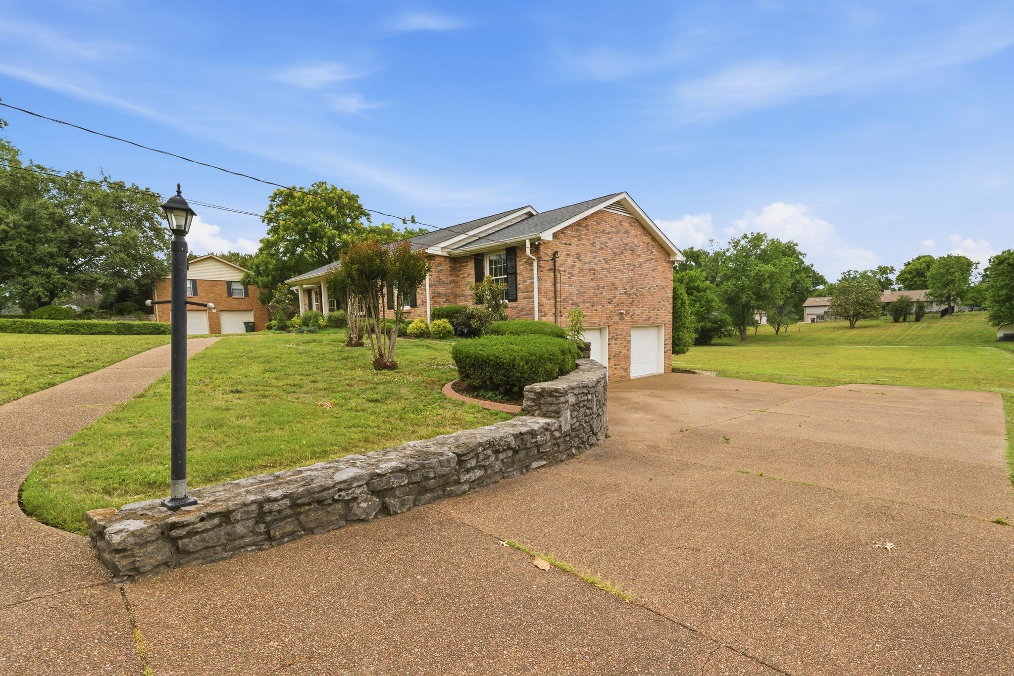 213 Rising Sun Lane Old Hickory, TN 37138 - Photo 4 of 37 a front view of a house with garden