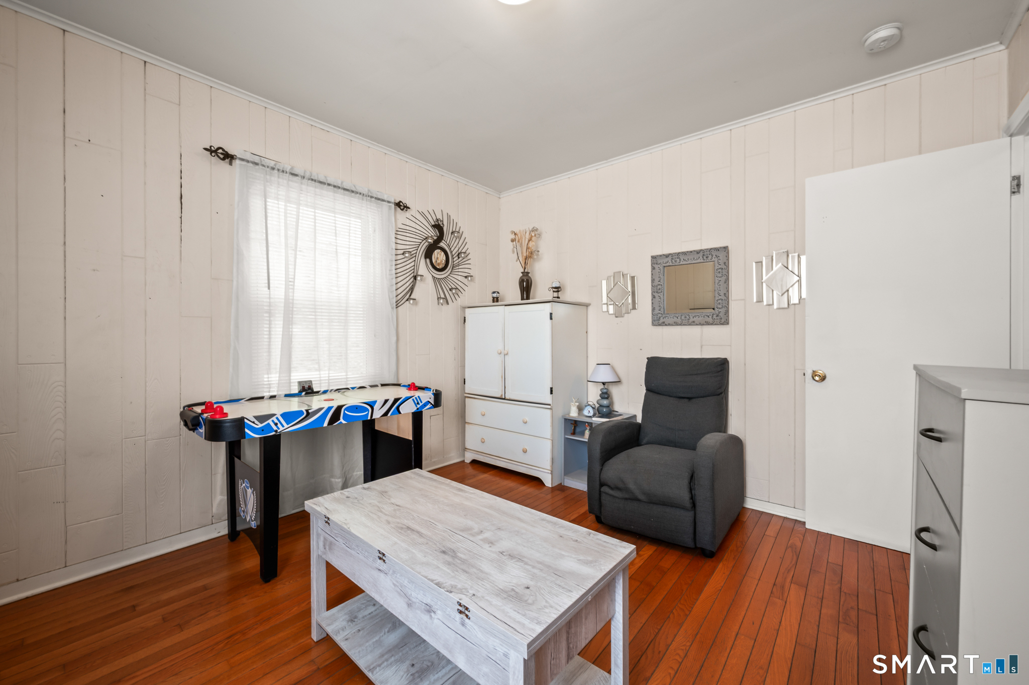 85 Dwight Street Ansonia, CT 06401 - Photo 12 of 40 a living room with furniture and a wooden floor