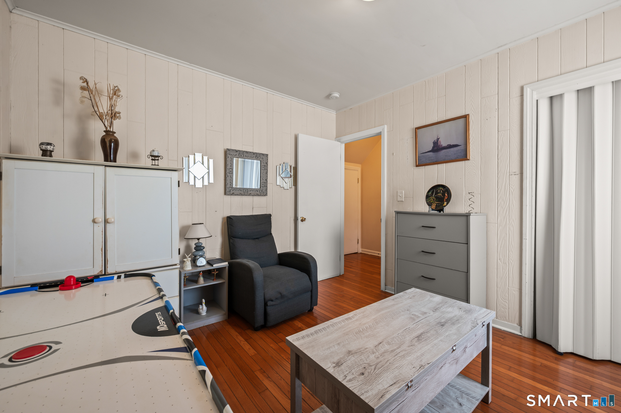 85 Dwight Street Ansonia, CT 06401 - Photo 13 of 40 a bedroom with furniture and a dresser