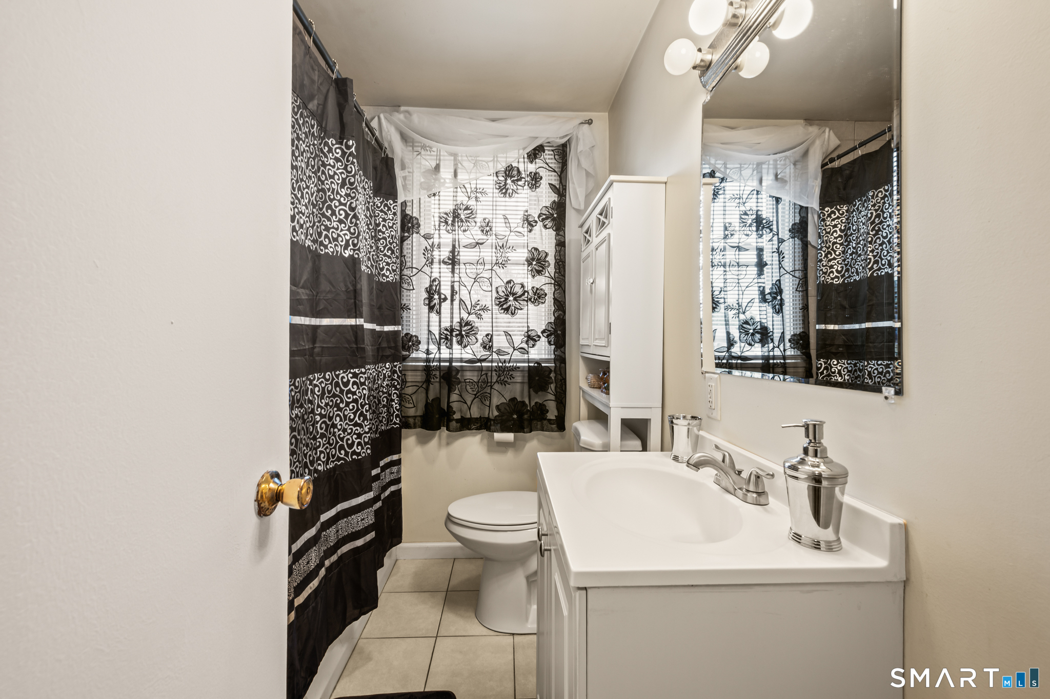 85 Dwight Street Ansonia, CT 06401 - Photo 17 of 40 a bathroom with a sink toilet and shower