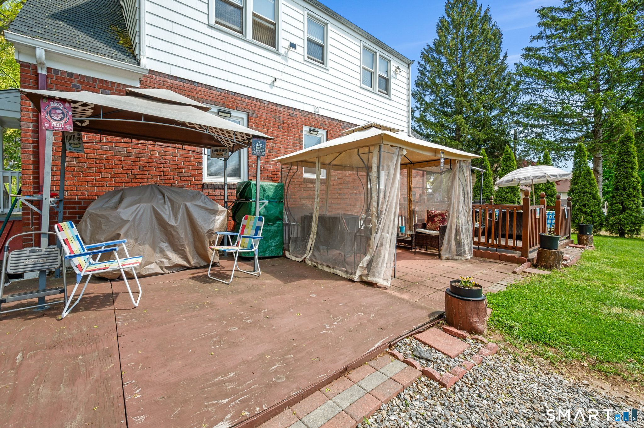 85 Dwight Street Ansonia, CT 06401 - Photo 28 of 40 a view of a chair and table in backyard of the house