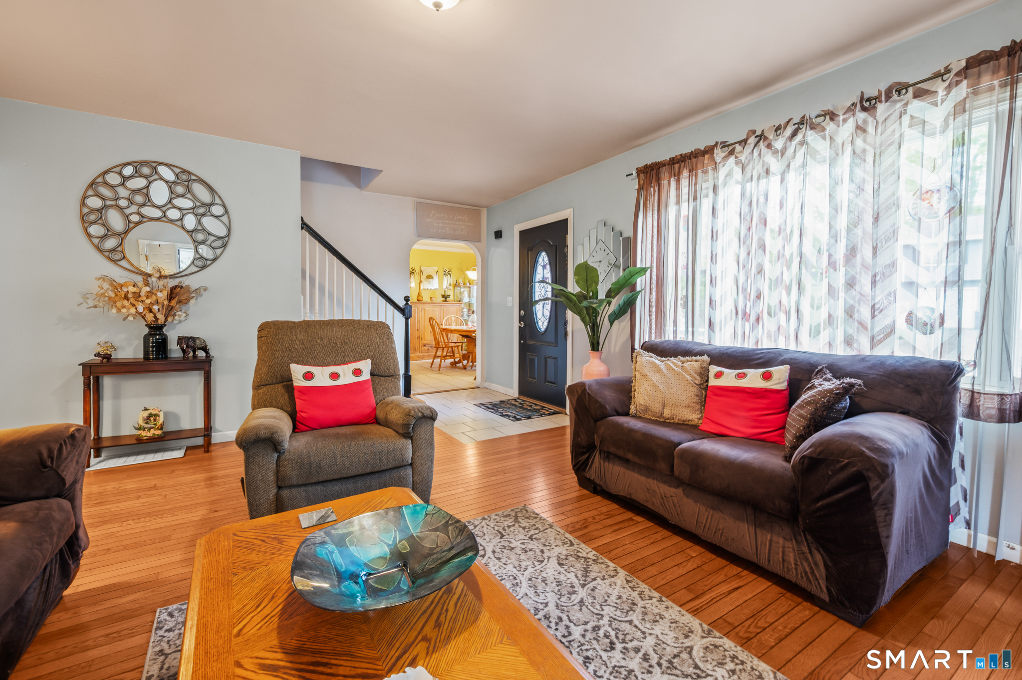 85 Dwight Street Ansonia, CT 06401 - Photo 4 of 40 a living room with furniture a rug and a window