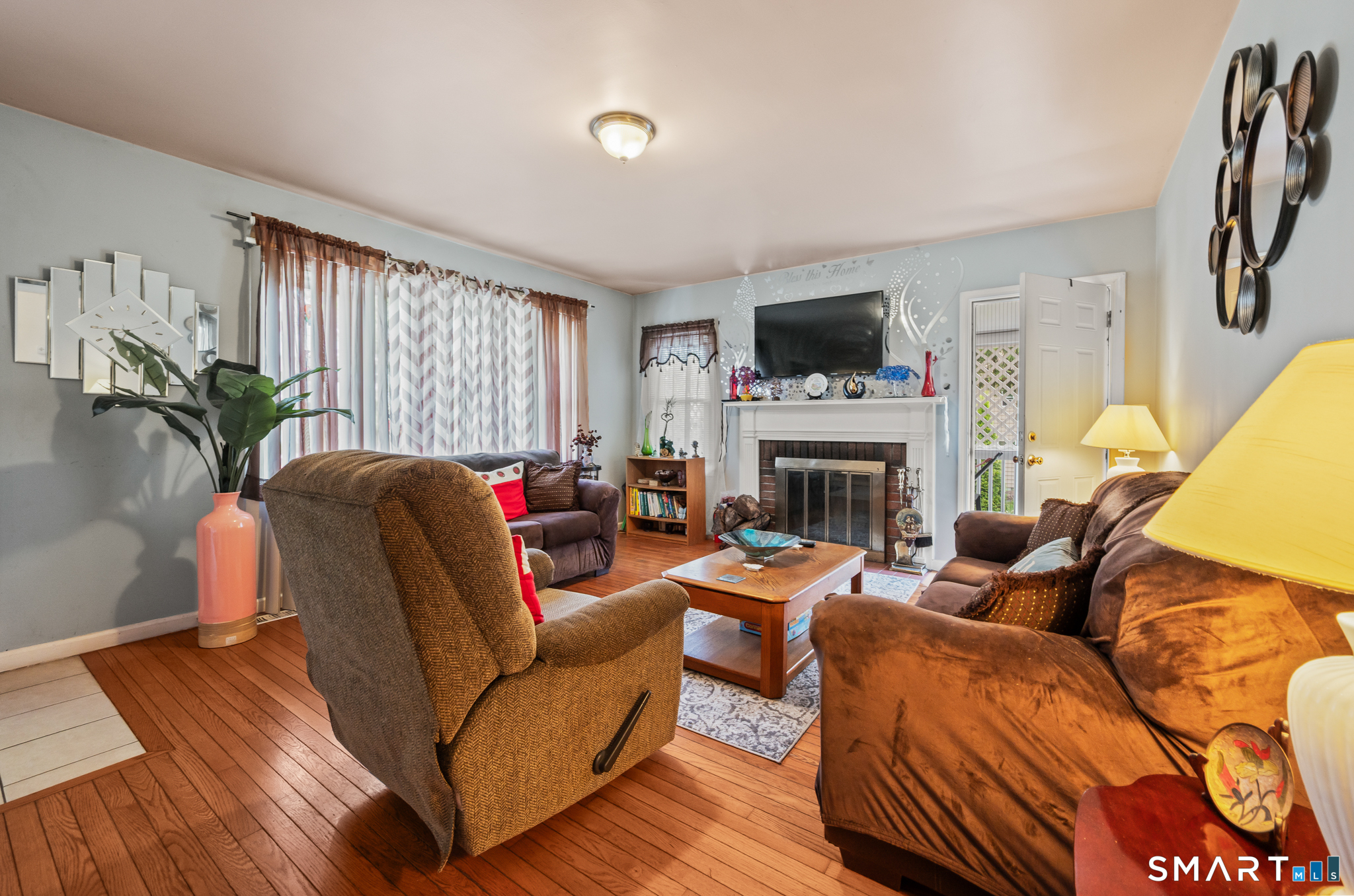 85 Dwight Street Ansonia, CT 06401 - Photo 6 of 40 a living room with furniture fireplace and flat screen tv