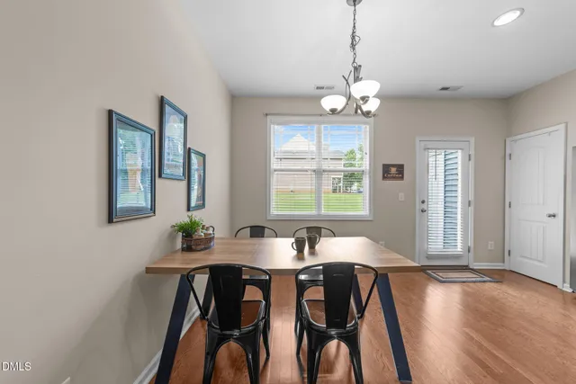 a kitchen with a refrigerator sink and cabinets