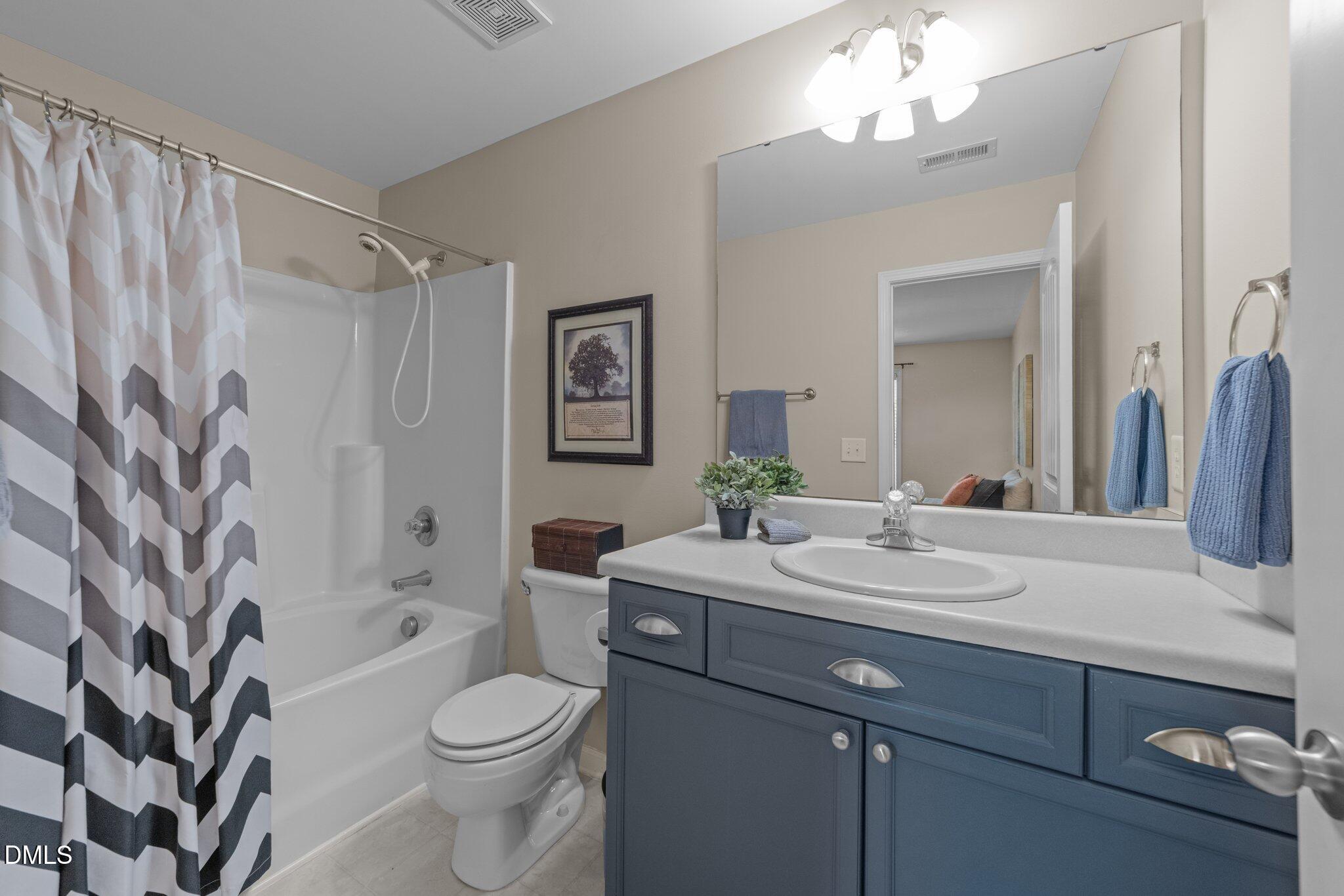 158 Pineland Circle Raleigh, NC 27606 - Photo 15 of 34 a bathroom with a sink a toilet and shower