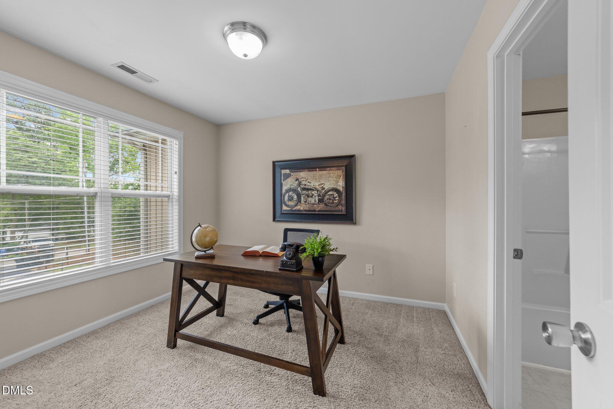 158 Pineland Circle Raleigh, NC 27606 - Photo 17 of 34 a view of a workspace with furniture and a window