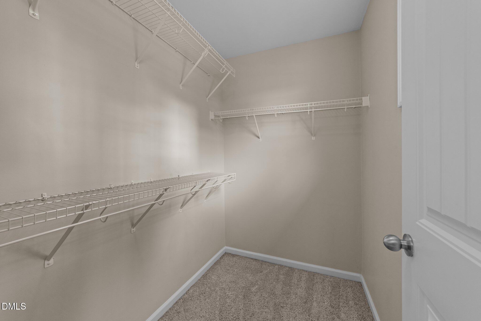 158 Pineland Circle Raleigh, NC 27606 - Photo 19 of 34 a view of a room with racks on the wall