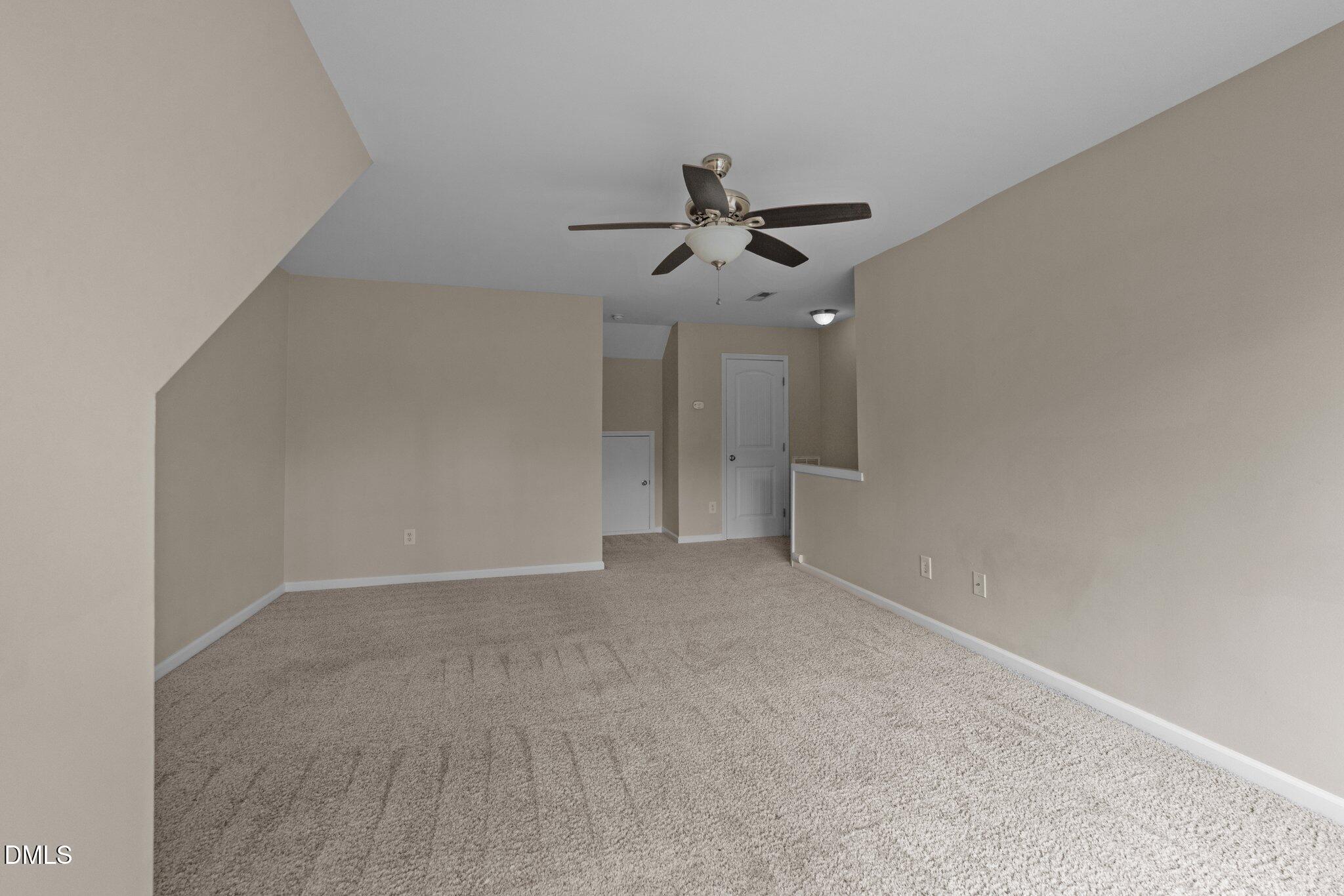 158 Pineland Circle Raleigh, NC 27606 - Photo 23 of 34 a view of an empty room and chandelier fan