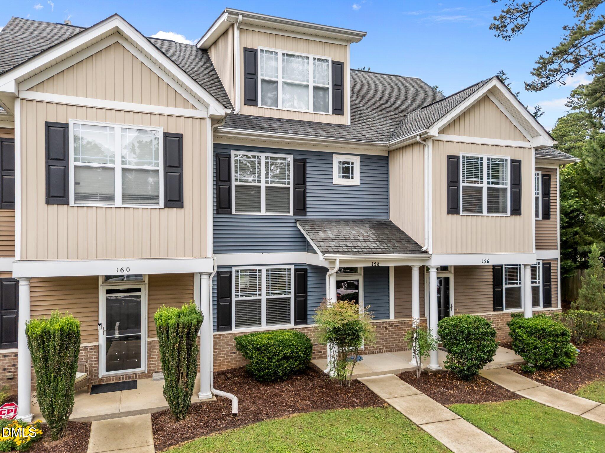 158 Pineland Circle Raleigh, NC 27606 - Photo 24 of 34 a front view of a house with yard and porch