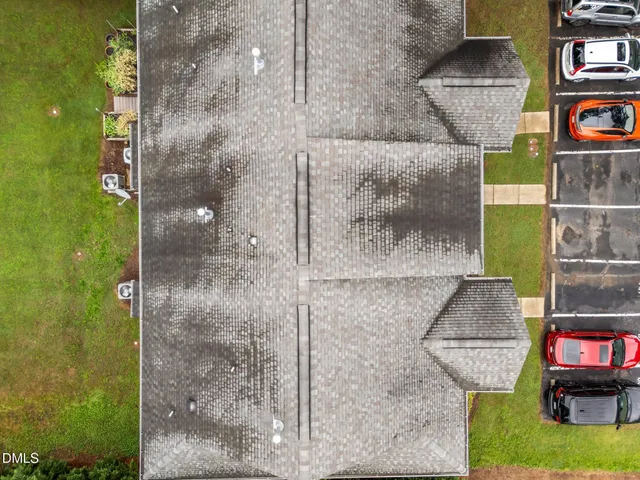 a front view of a house with yard and porch