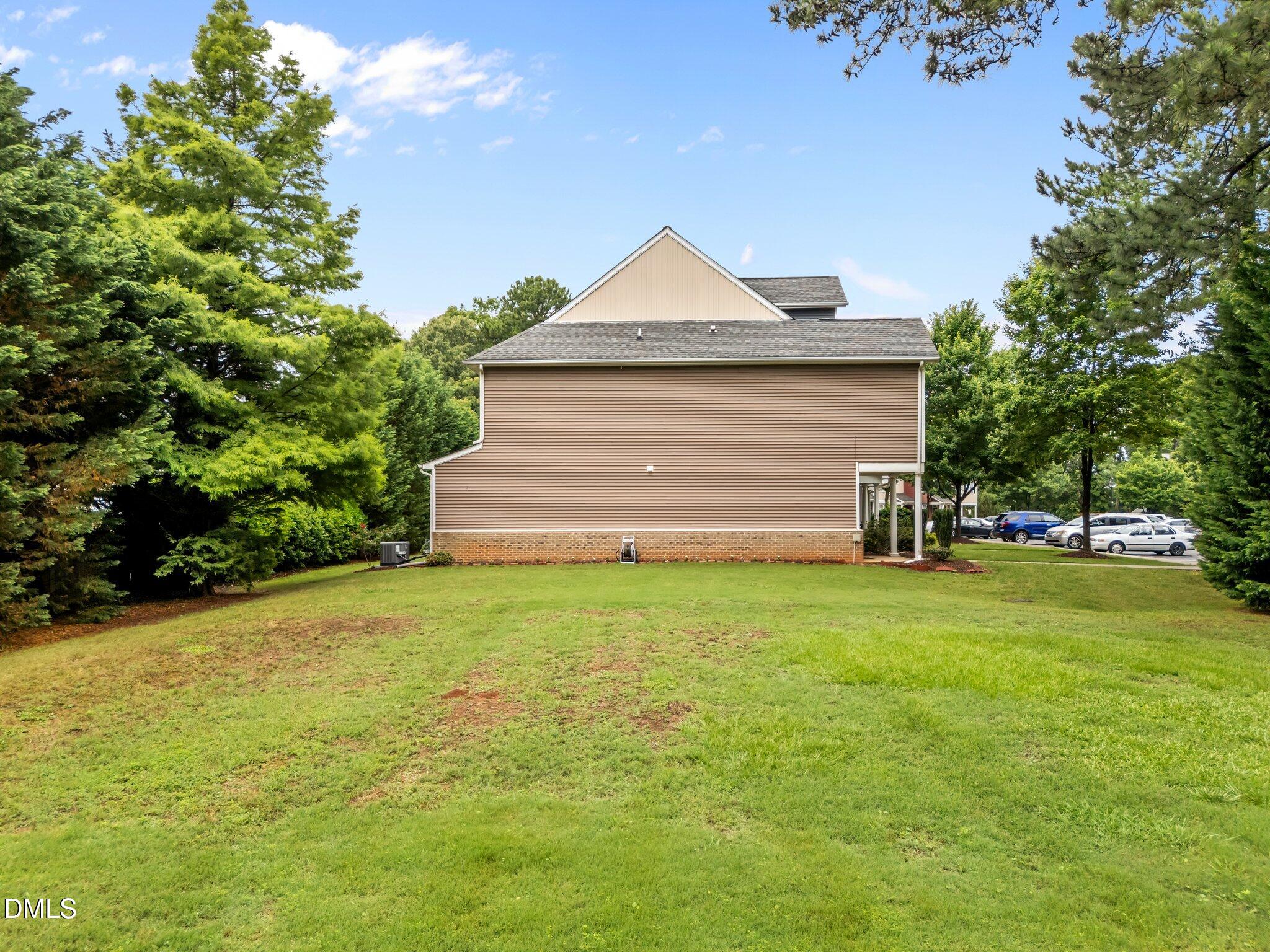 158 Pineland Circle Raleigh, NC 27606 - Photo 26 of 34 a front view of house with yard and trees