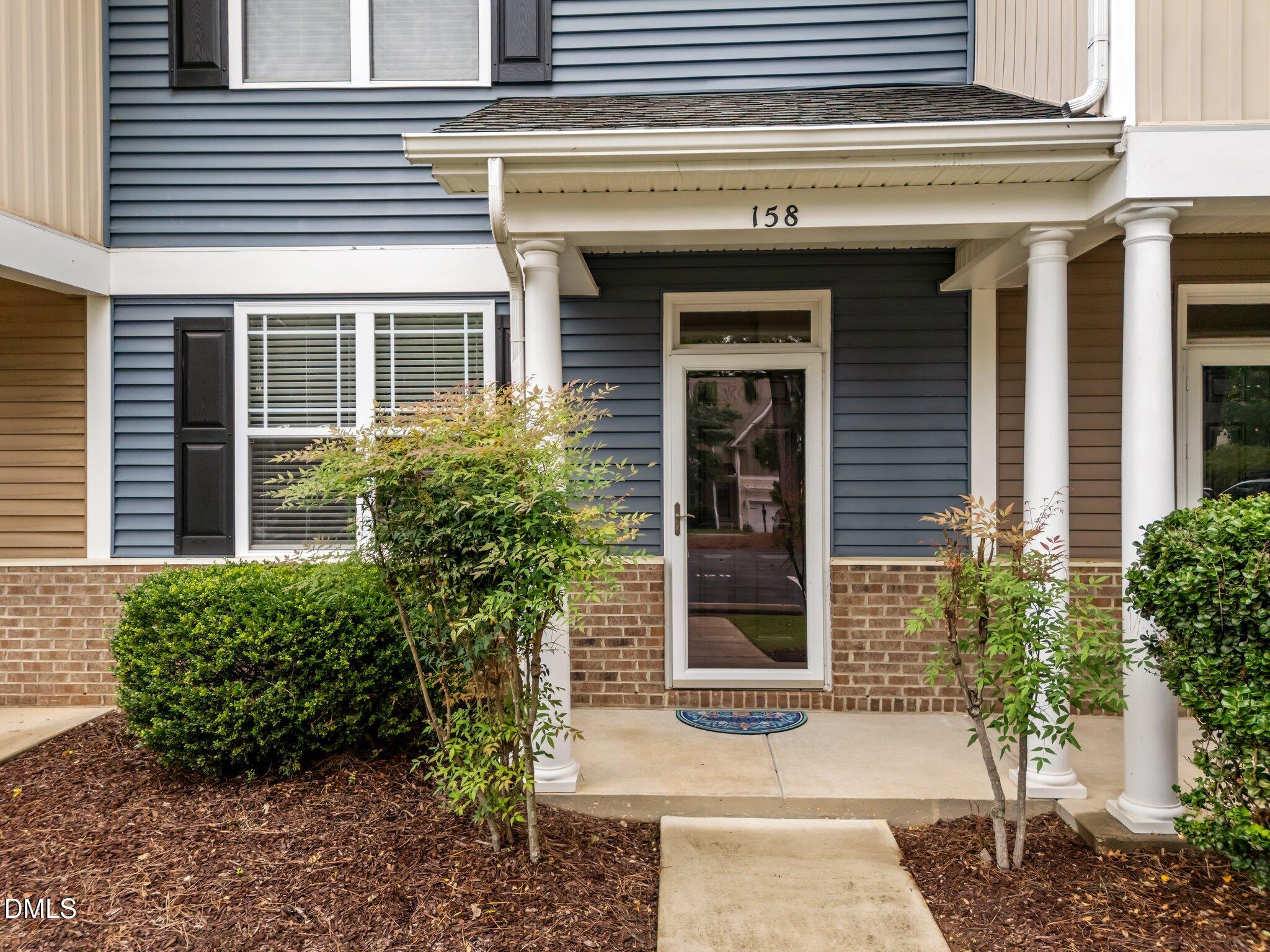 158 Pineland Circle Raleigh, NC 27606 - Photo 2 of 34 a view of a entrance door of the house