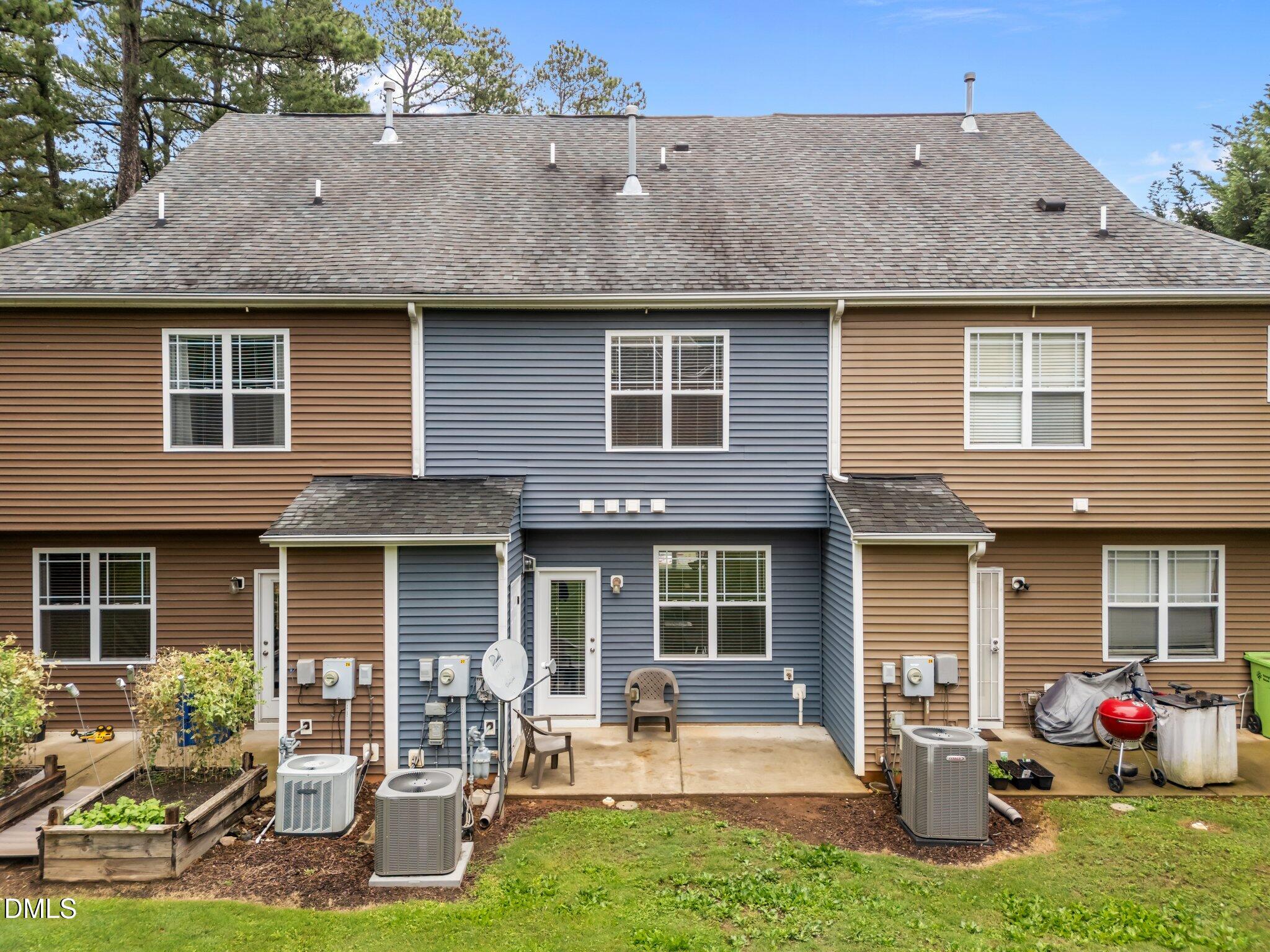 158 Pineland Circle Raleigh, NC 27606 - Photo 31 of 34 a front view of a house with a yard and outdoor seating