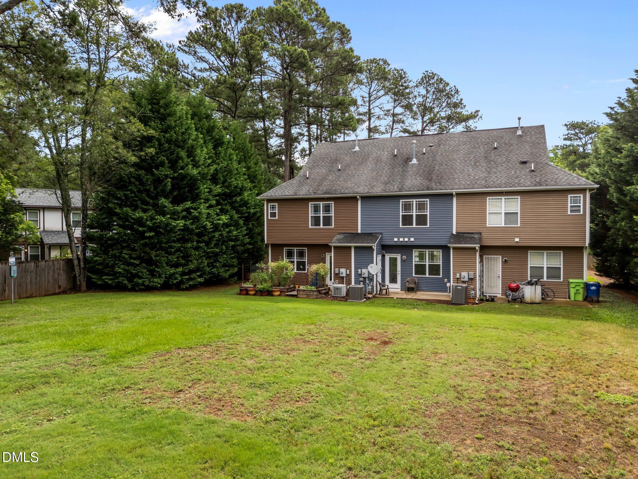 158 Pineland Circle Raleigh, NC 27606 - Photo 33 of 34 front view of a house with a garden