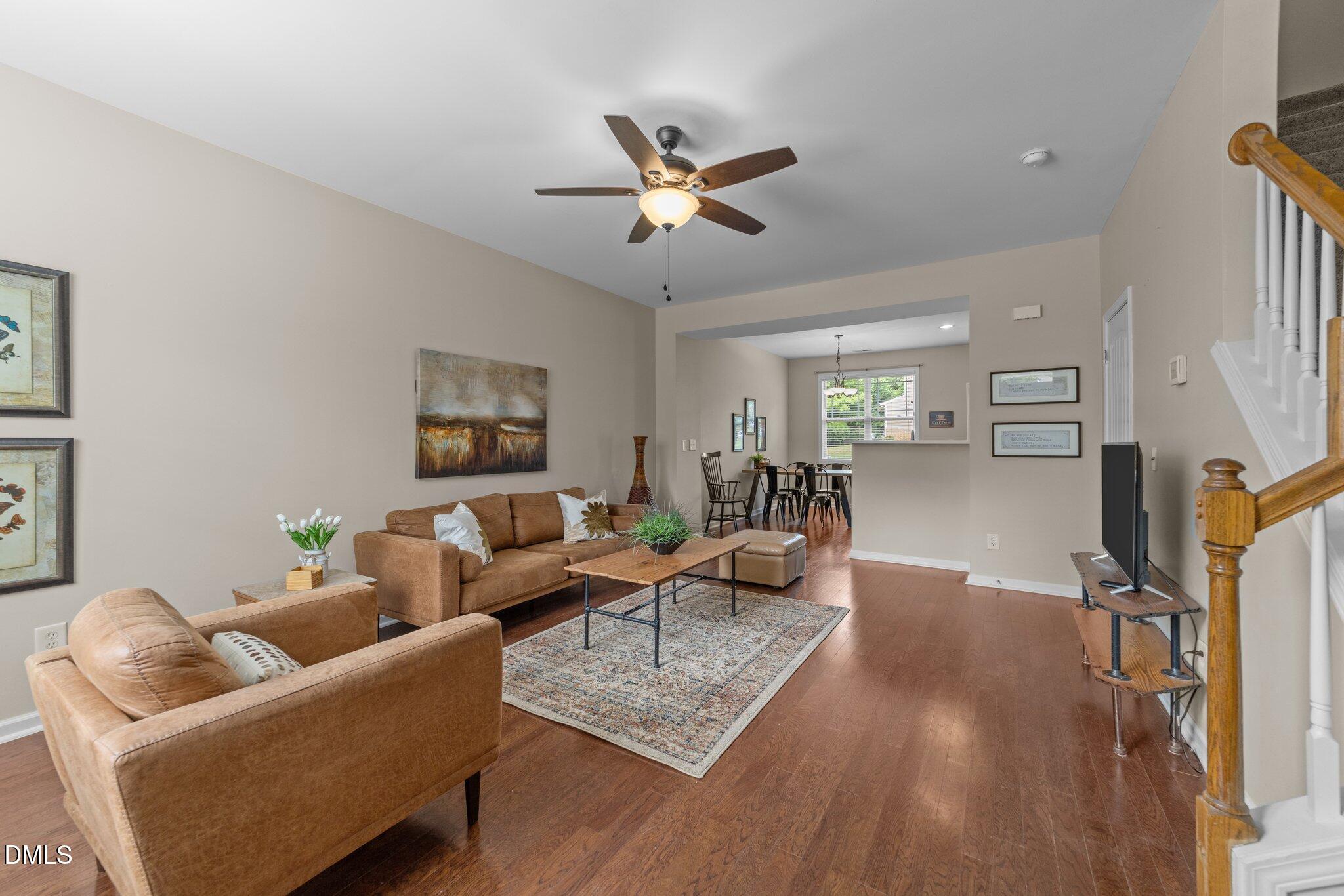 158 Pineland Circle Raleigh, NC 27606 - Photo 4 of 34 a living room with furniture and a flat screen tv