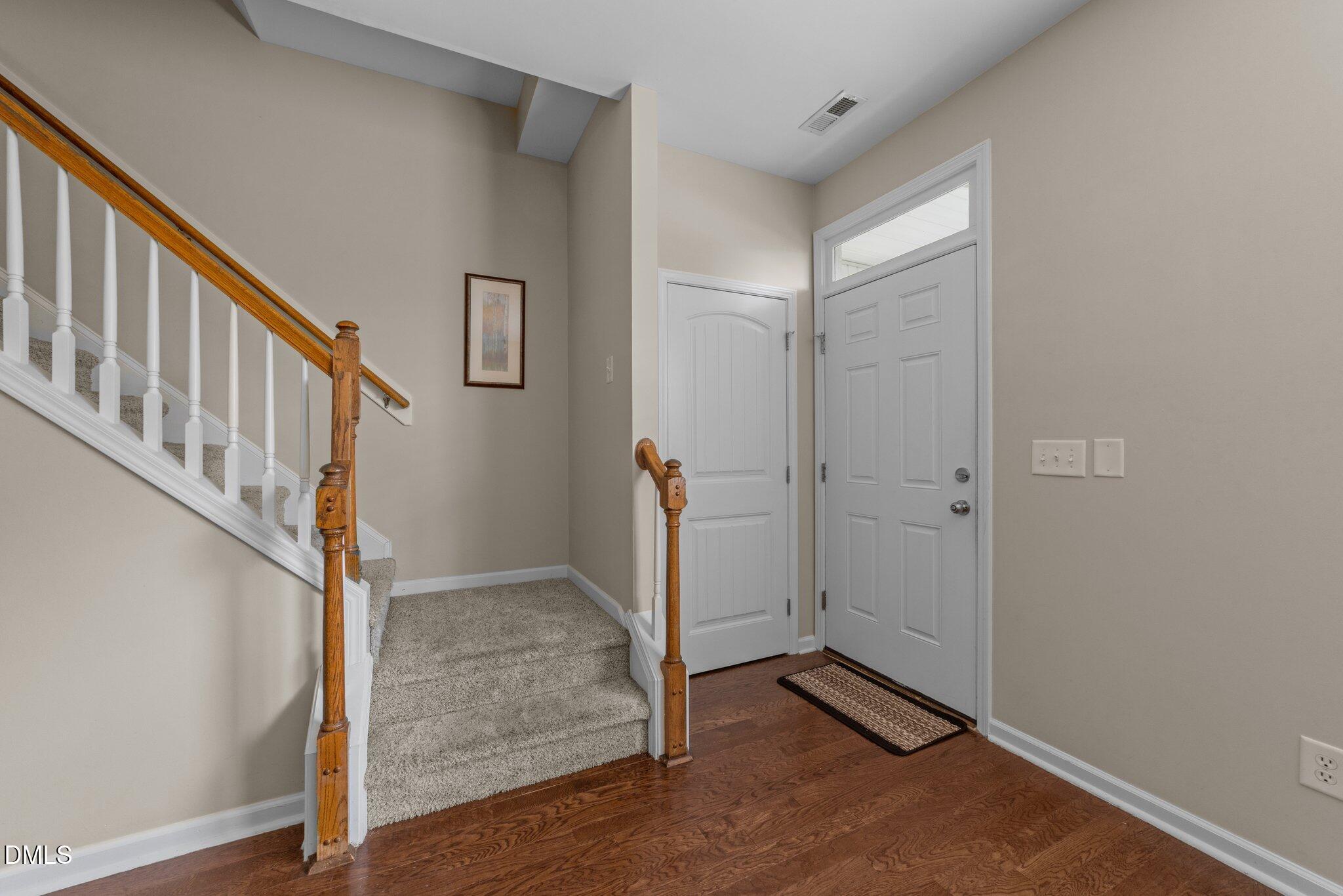 158 Pineland Circle Raleigh, NC 27606 - Photo 5 of 34 a view of an entryway with wooden floor