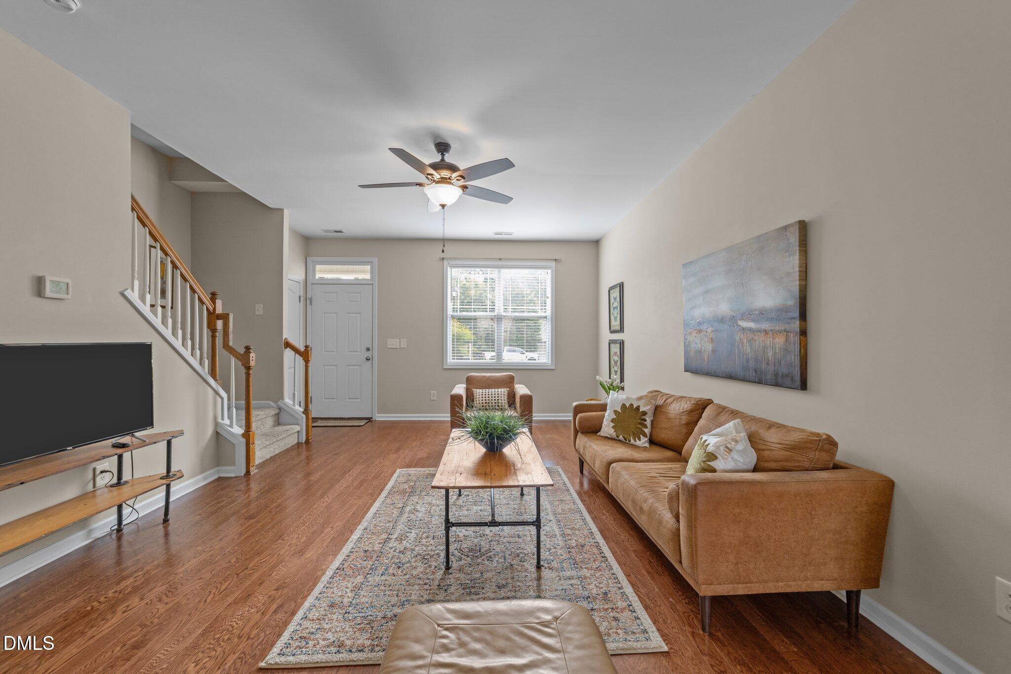 158 Pineland Circle Raleigh, NC 27606 - Photo 6 of 34 a living room with furniture flat screen tv and a window