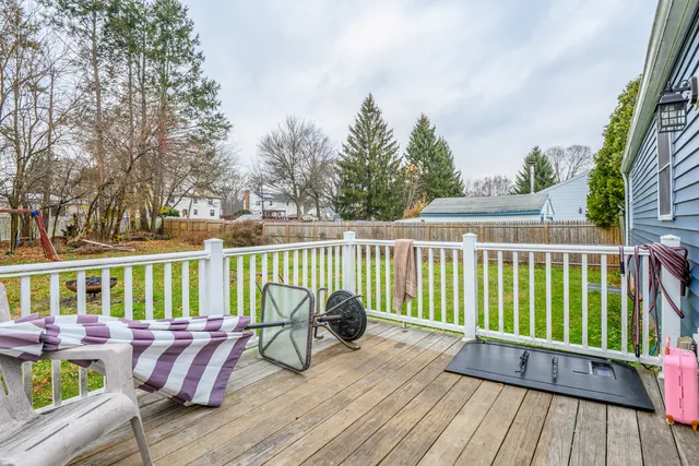 a view of balcony with couch and wooden fence