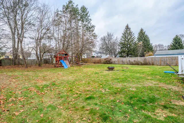 a view of a yard with a slide