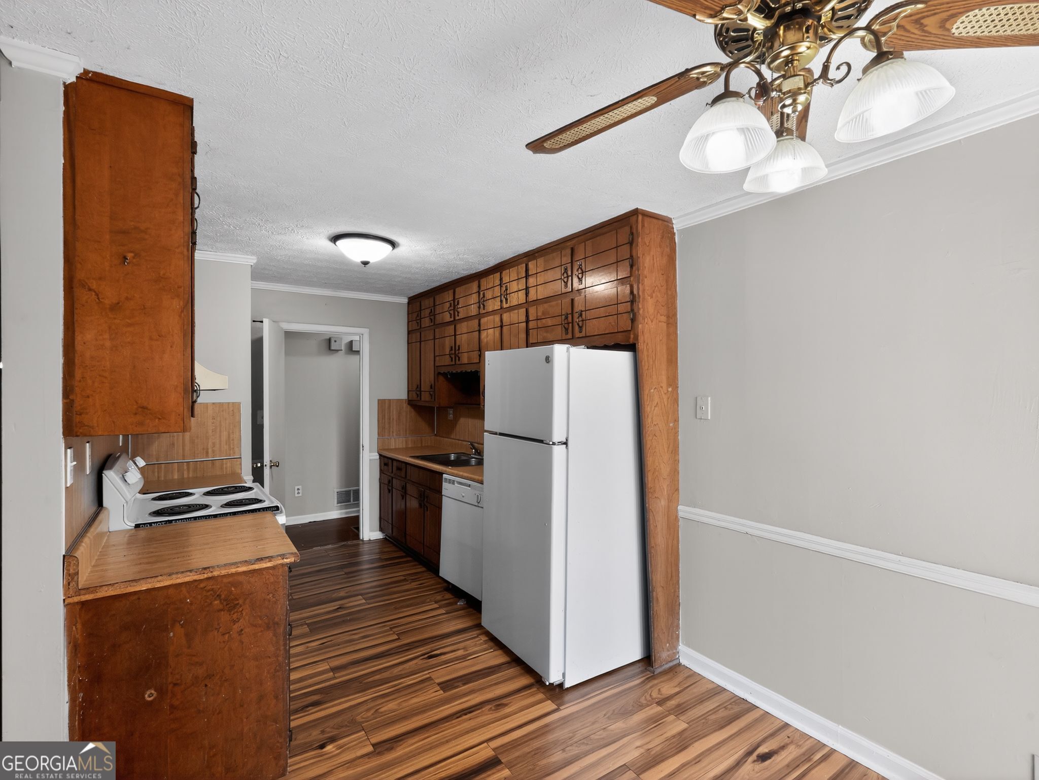 556 Roy Huie Road Riverdale, GA 30274 - Photo 13 of 31 a kitchen with a refrigerator and a stove