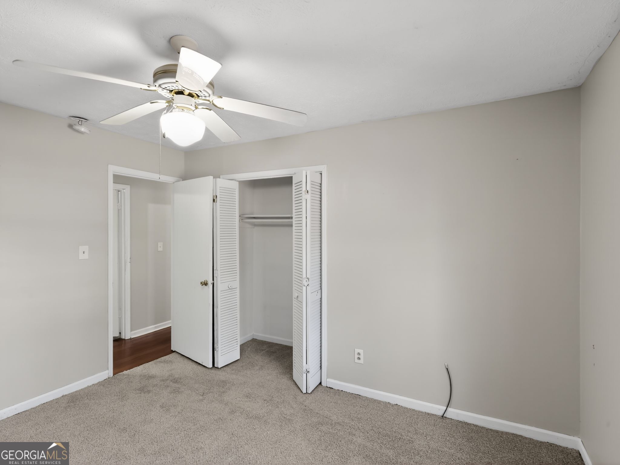 556 Roy Huie Road Riverdale, GA 30274 - Photo 21 of 31 an empty room with a fan and a fan