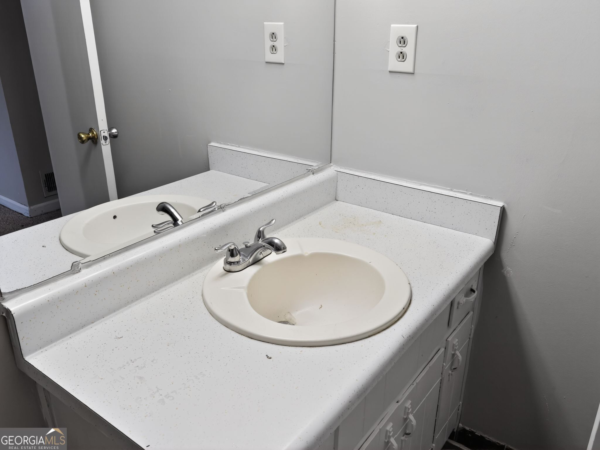 556 Roy Huie Road Riverdale, GA 30274 - Photo 23 of 31 a bathroom with a sink and a mirror