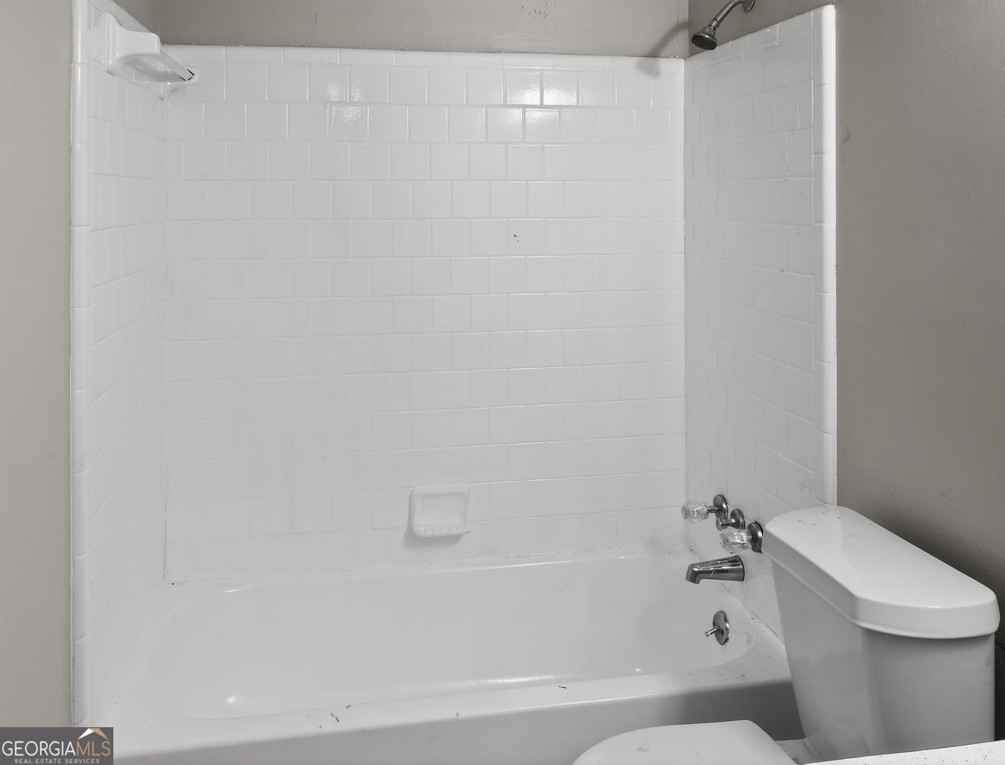556 Roy Huie Road Riverdale, GA 30274 - Photo 24 of 31 a bathroom with a bathtub and a toilet