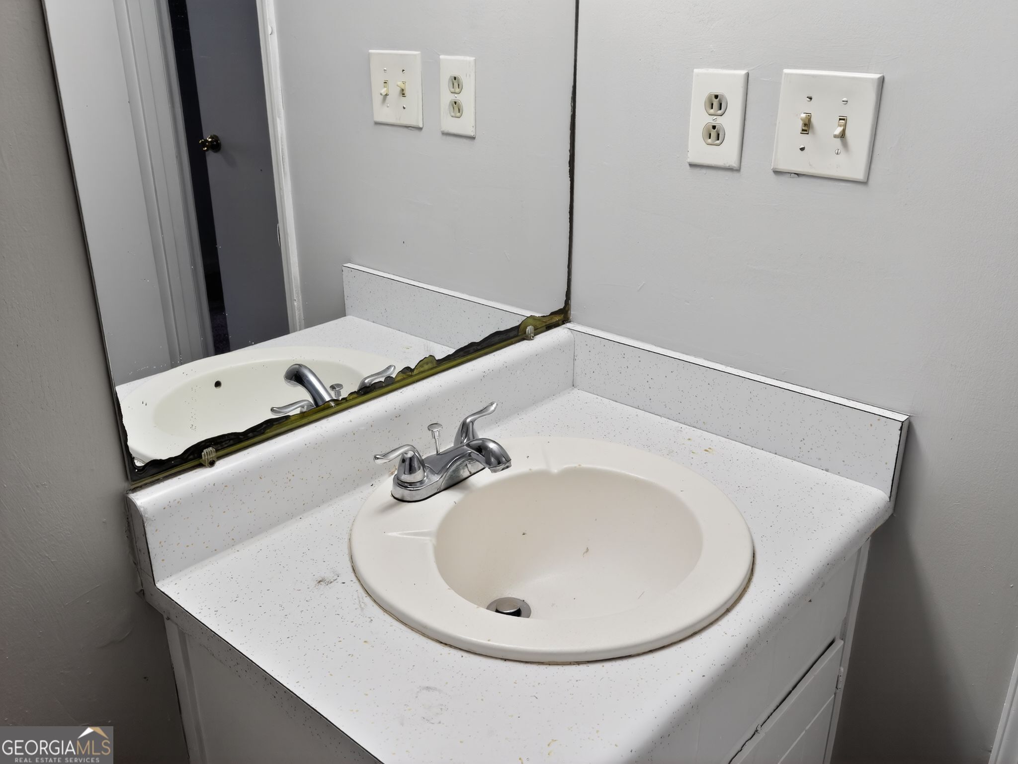 556 Roy Huie Road Riverdale, GA 30274 - Photo 25 of 31 a bathroom with a sink and a mirror