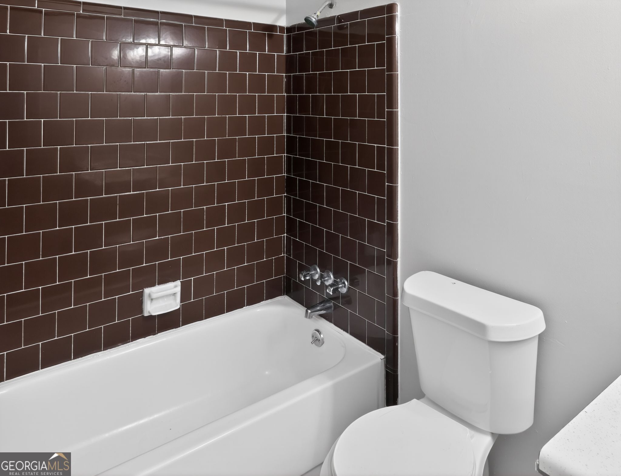 556 Roy Huie Road Riverdale, GA 30274 - Photo 26 of 31 a view of a bathroom with toilet and bathtub
