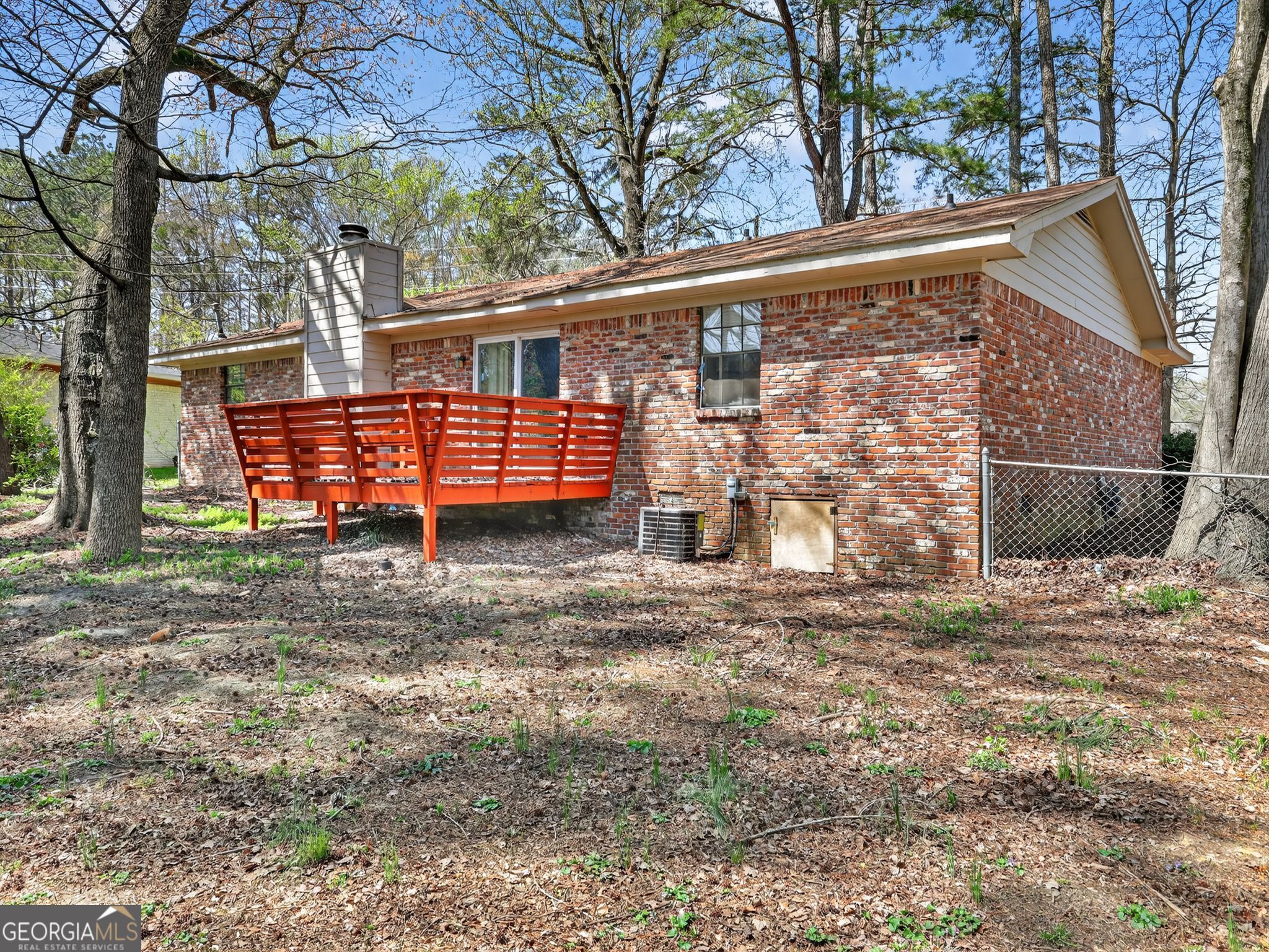 556 Roy Huie Road Riverdale, GA 30274 - Photo 30 of 31 a view of a backyard with a large tree