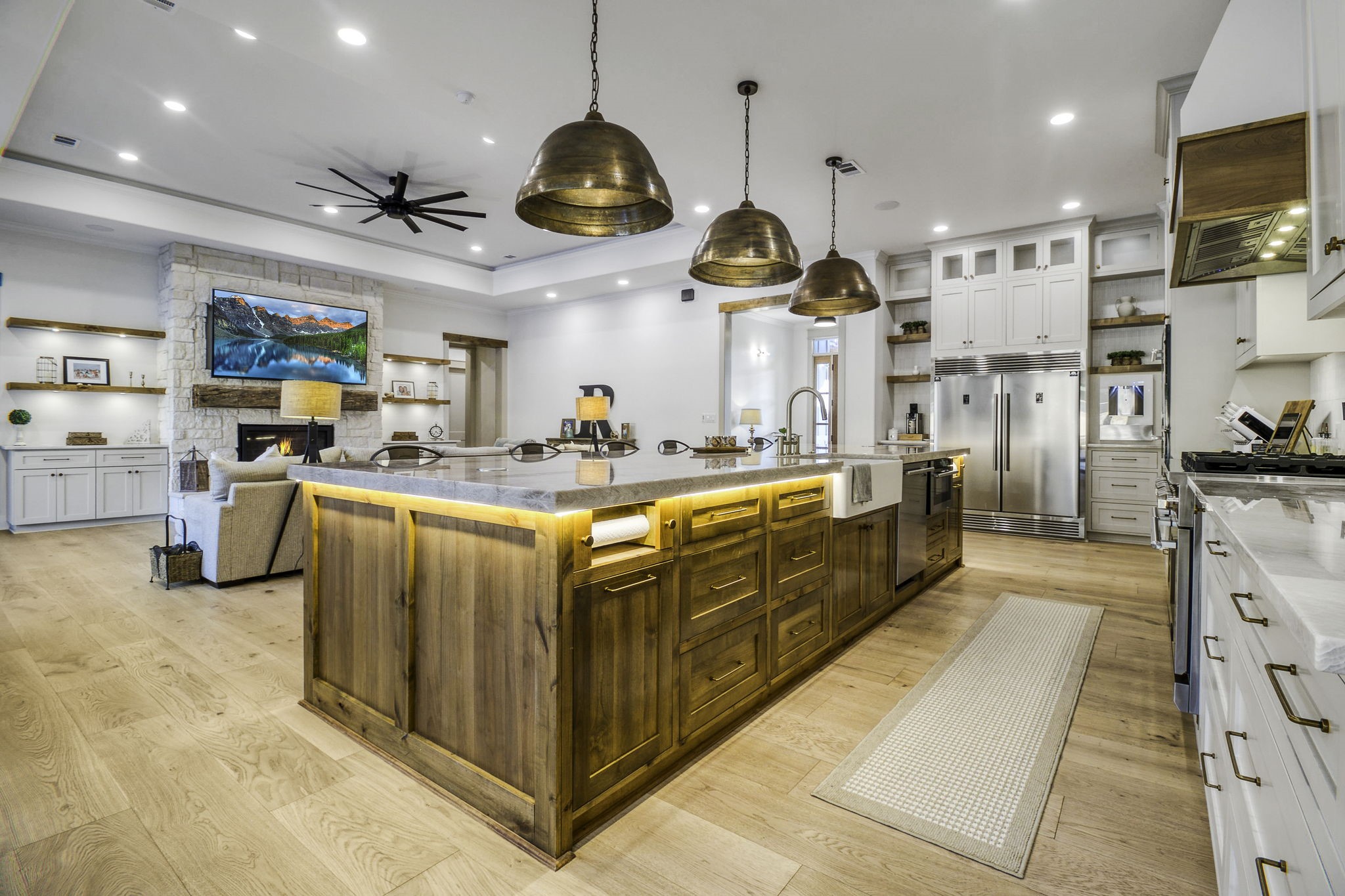 4602 Fm 3459 Road Onalaska, TX 77360 - Photo 12 of 45 a kitchen with stainless steel appliances kitchen island granite countertop a sink and a refrigerator